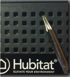 If you are accidentally blocked from accessing your hub due to an incorrect or unknown IP address setting, turn the hub over and use the point of a pen to press a small button just beneath the surface of the hub casing for at least 7 seconds. All of the holes on the bottom of the hub are square in shape, but one hole is round. With the hub upside-down and the Ethernet port at the top, the round hole will be in the top row, sixth from the right.